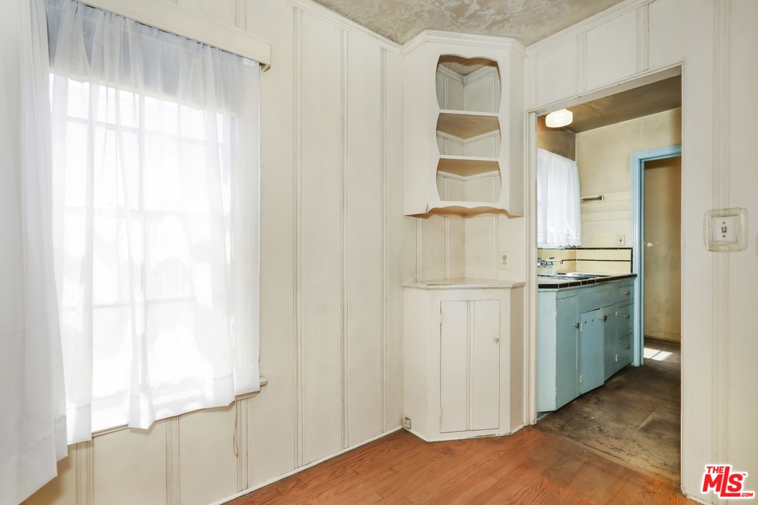 4053 Verdugo Road Los Angeles, CA 90065 - Photo 20 of 45 a bathroom with a granite countertop sink and a mirror