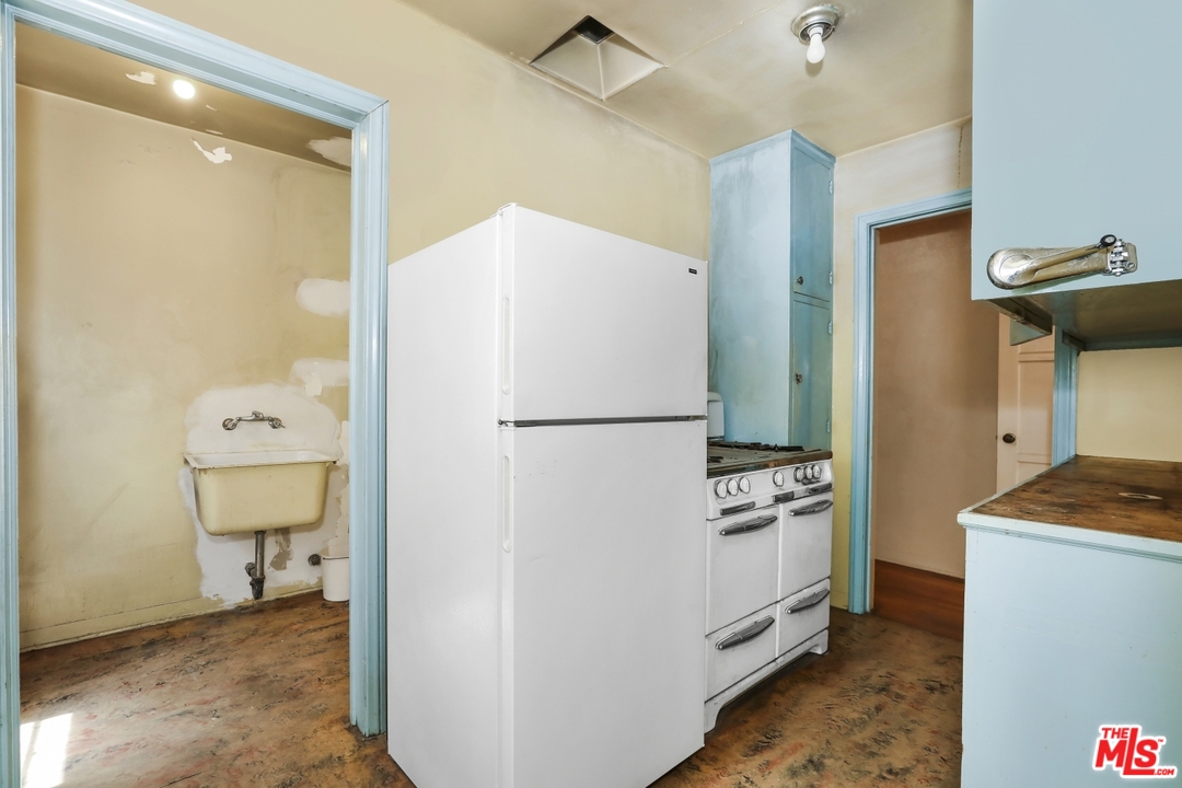 4053 Verdugo Road Los Angeles, CA 90065 - Photo 22 of 45 a kitchen with a refrigerator and a stove