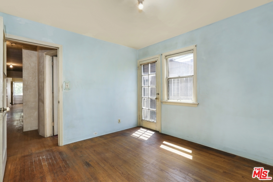 4053 Verdugo Road Los Angeles, CA 90065 - Photo 28 of 45 an empty room with wooden floor and windows