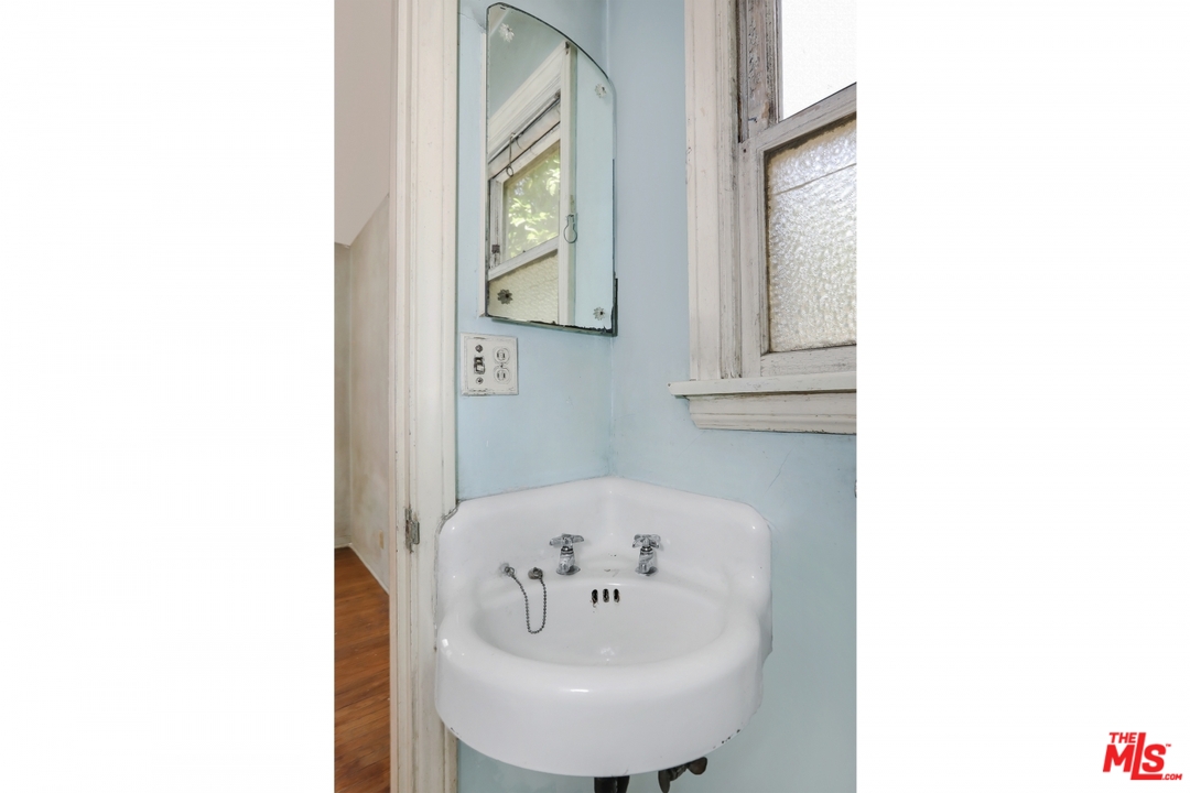 4053 Verdugo Road Los Angeles, CA 90065 - Photo 29 of 45 a bathroom with a sink and a mirror