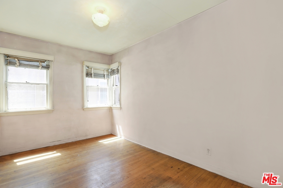 4053 Verdugo Road Los Angeles, CA 90065 - Photo 30 of 45 an empty room with wooden floor and windows