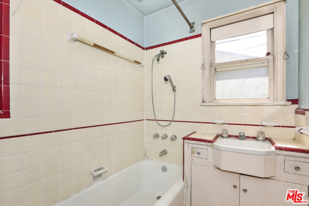 4053 Verdugo Road Los Angeles, CA 90065 - Photo 32 of 45 a bathroom with a sink a bath tub and a shower