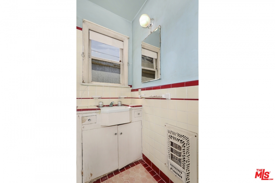 4053 Verdugo Road Los Angeles, CA 90065 - Photo 33 of 45 a bathroom with a sink and a mirror