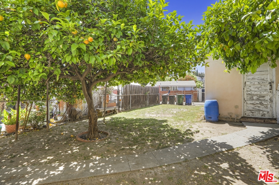 4053 Verdugo Road Los Angeles, CA 90065 - Photo 41 of 45 a view of a brick house with a yard