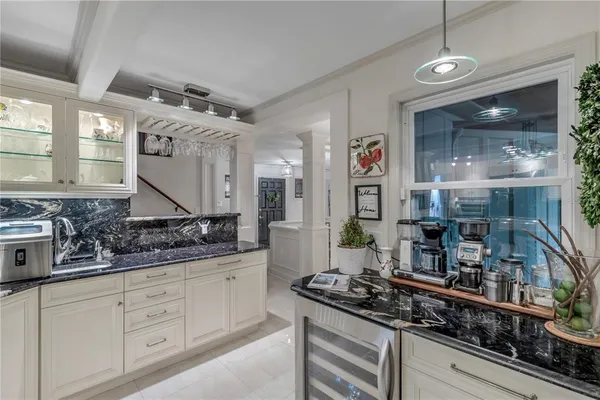 an open kitchen with a stove and a sink