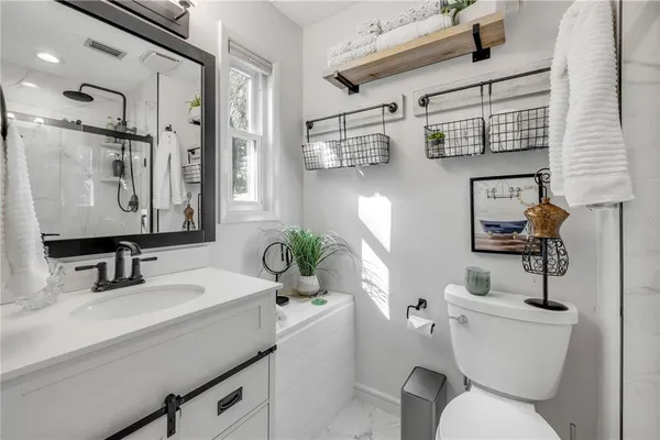 a view of backyard with seating area and trees