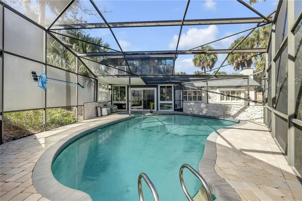 a view of house with outdoor seating and wooden floor