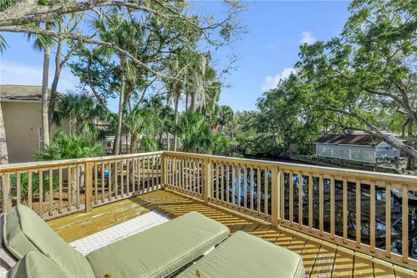 a front view of a house with a yard table and chairs