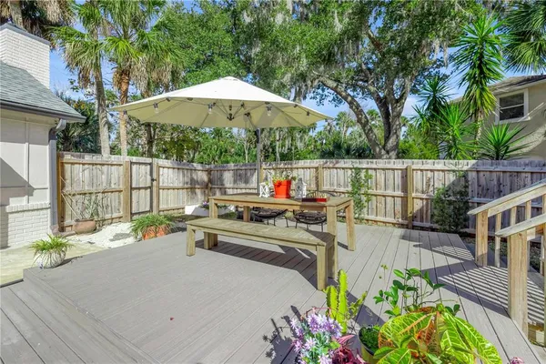 a kitchen with a dining table and chairs