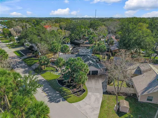 a view of a garden with a building in the background