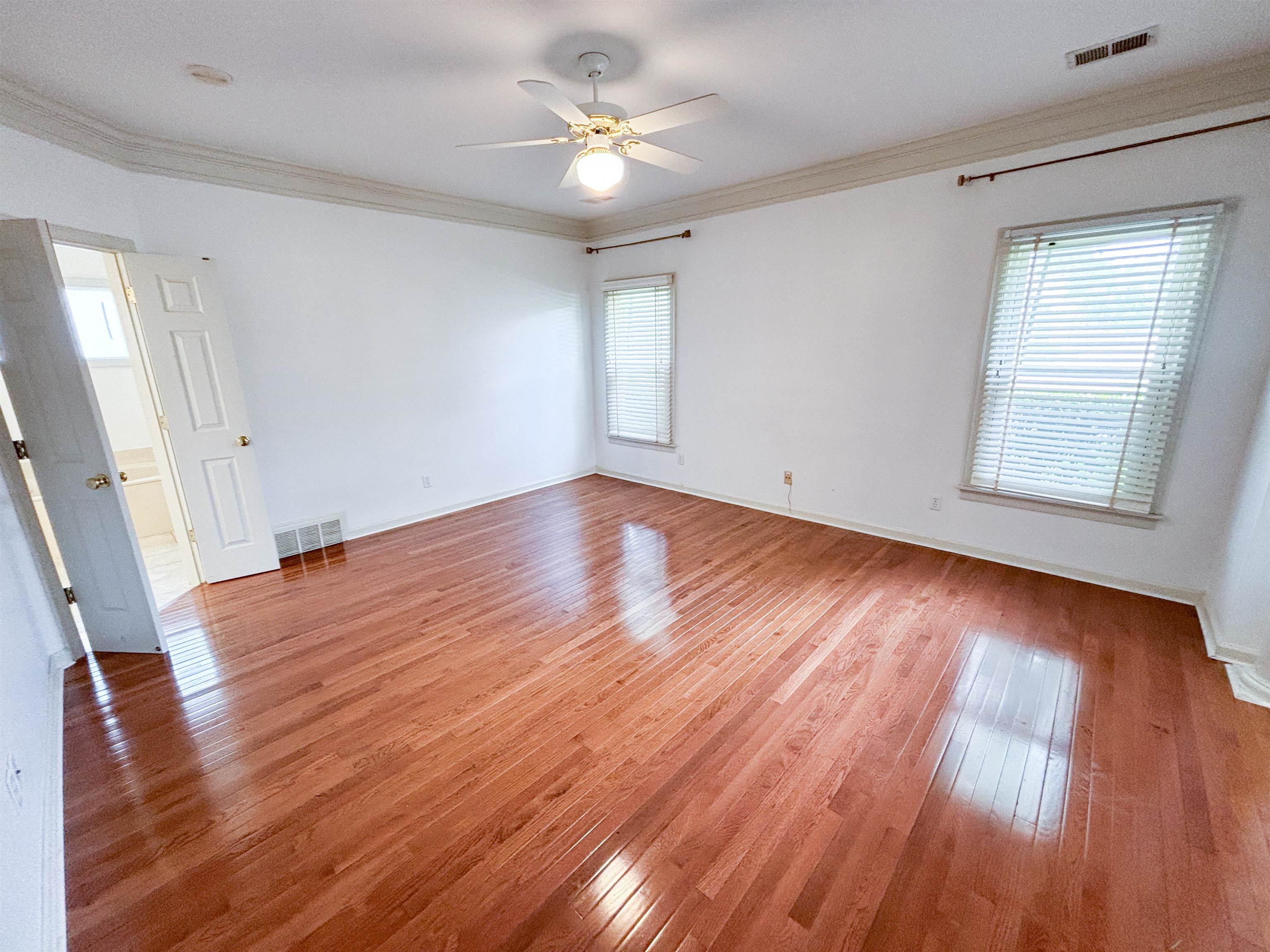 1923 Swynford Lane Collierville, TN 38017 - Photo 16 of 35 a view of an empty room with wooden floor and a window