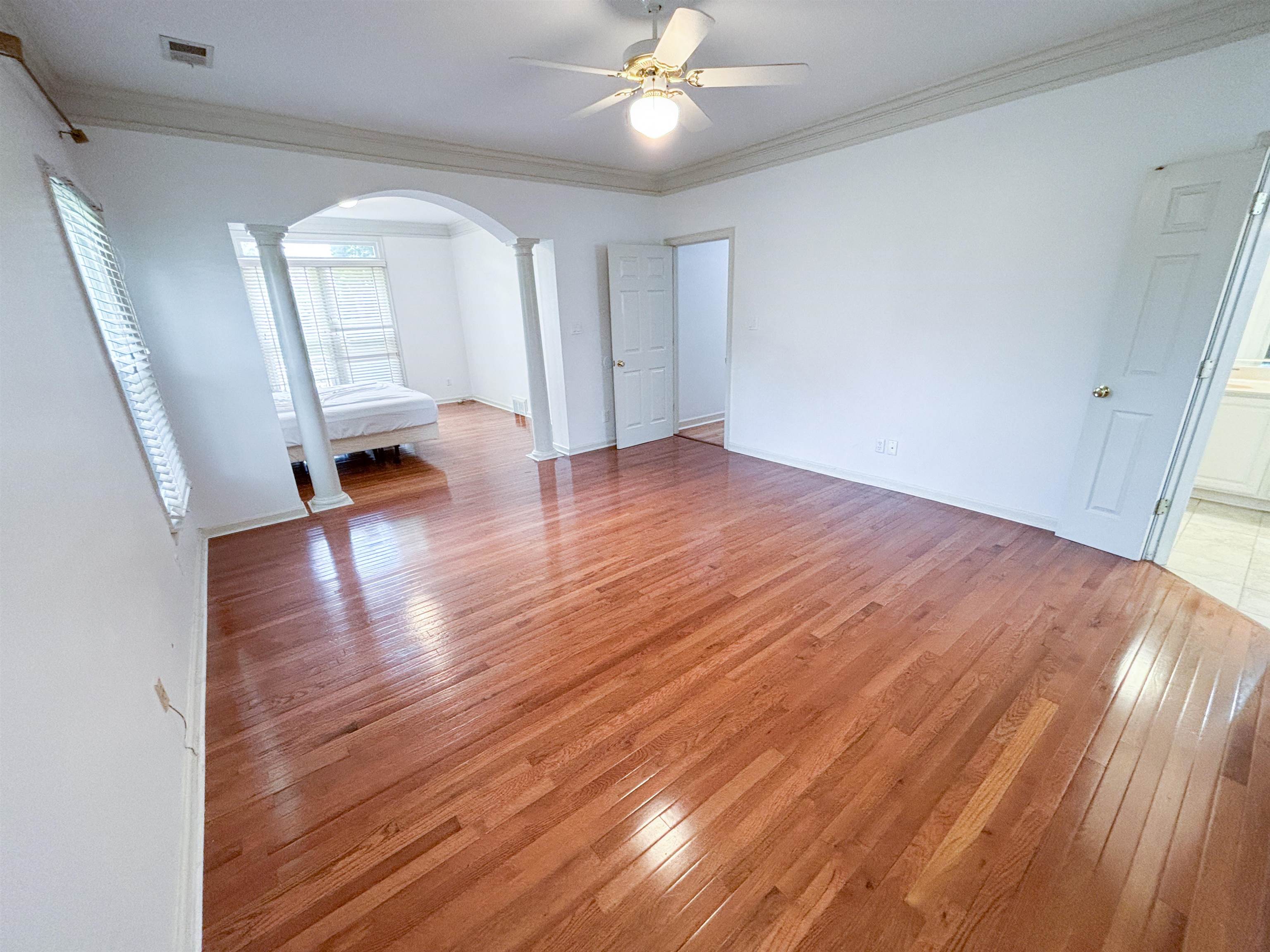 1923 Swynford Lane Collierville, TN 38017 - Photo 17 of 35 wooden floor in an empty room with a window