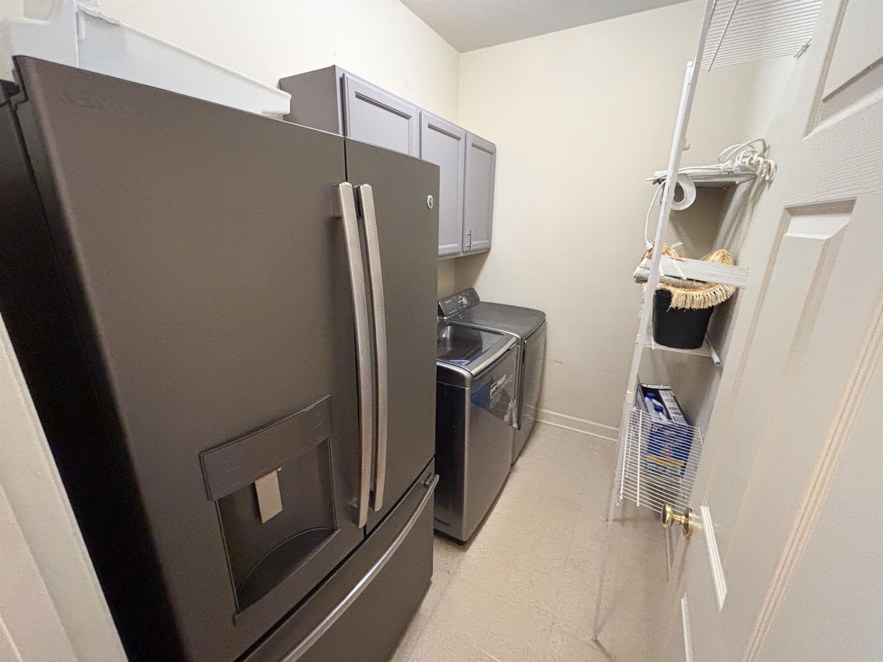 1923 Swynford Lane Collierville, TN 38017 - Photo 20 of 35 a view of a storage and utility room with refrigerator