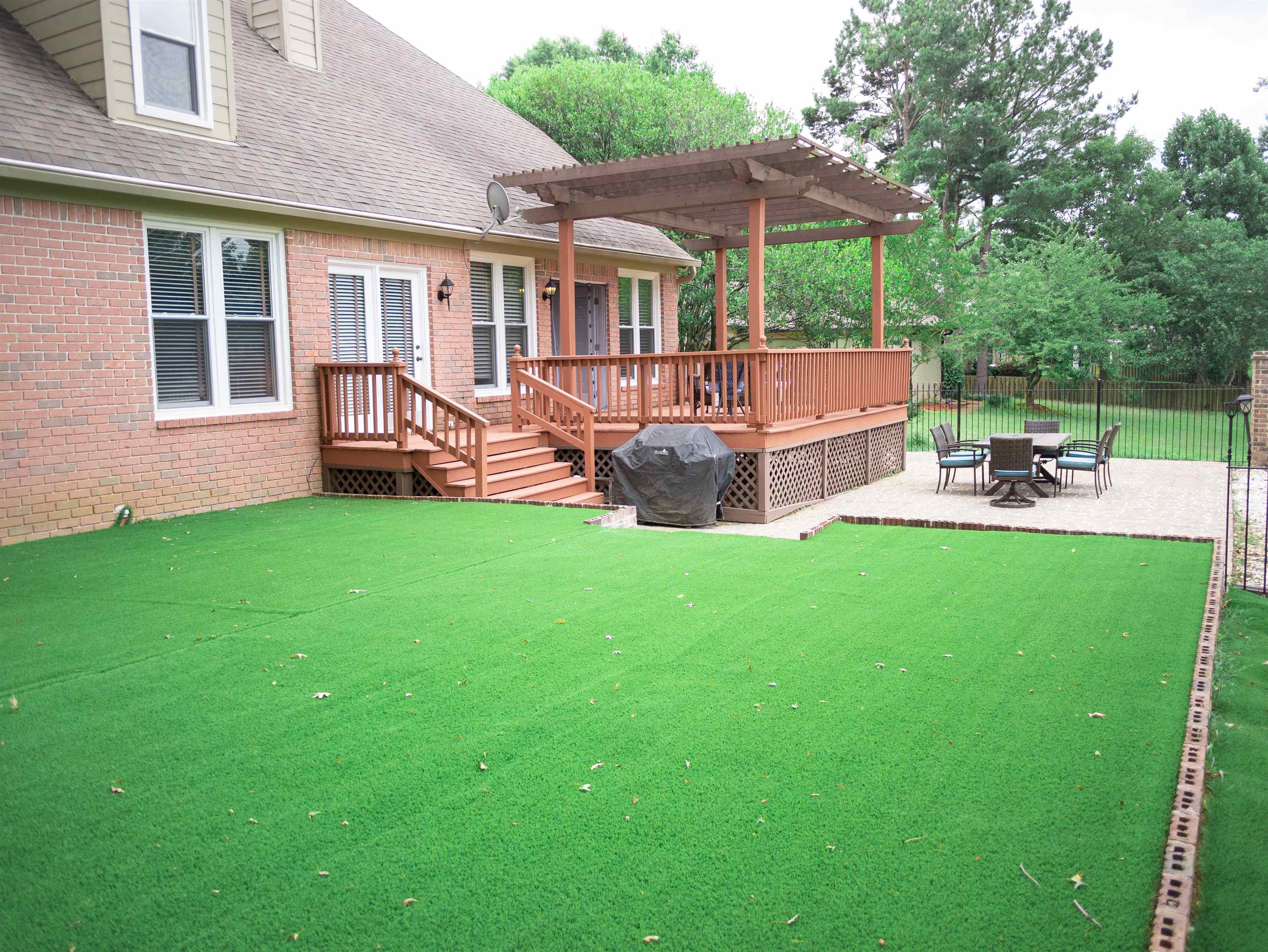 1923 Swynford Lane Collierville, TN 38017 - Photo 28 of 35 Rear view of property with a pergola, roof with shingles, a wooden deck, a patio area, and brick siding