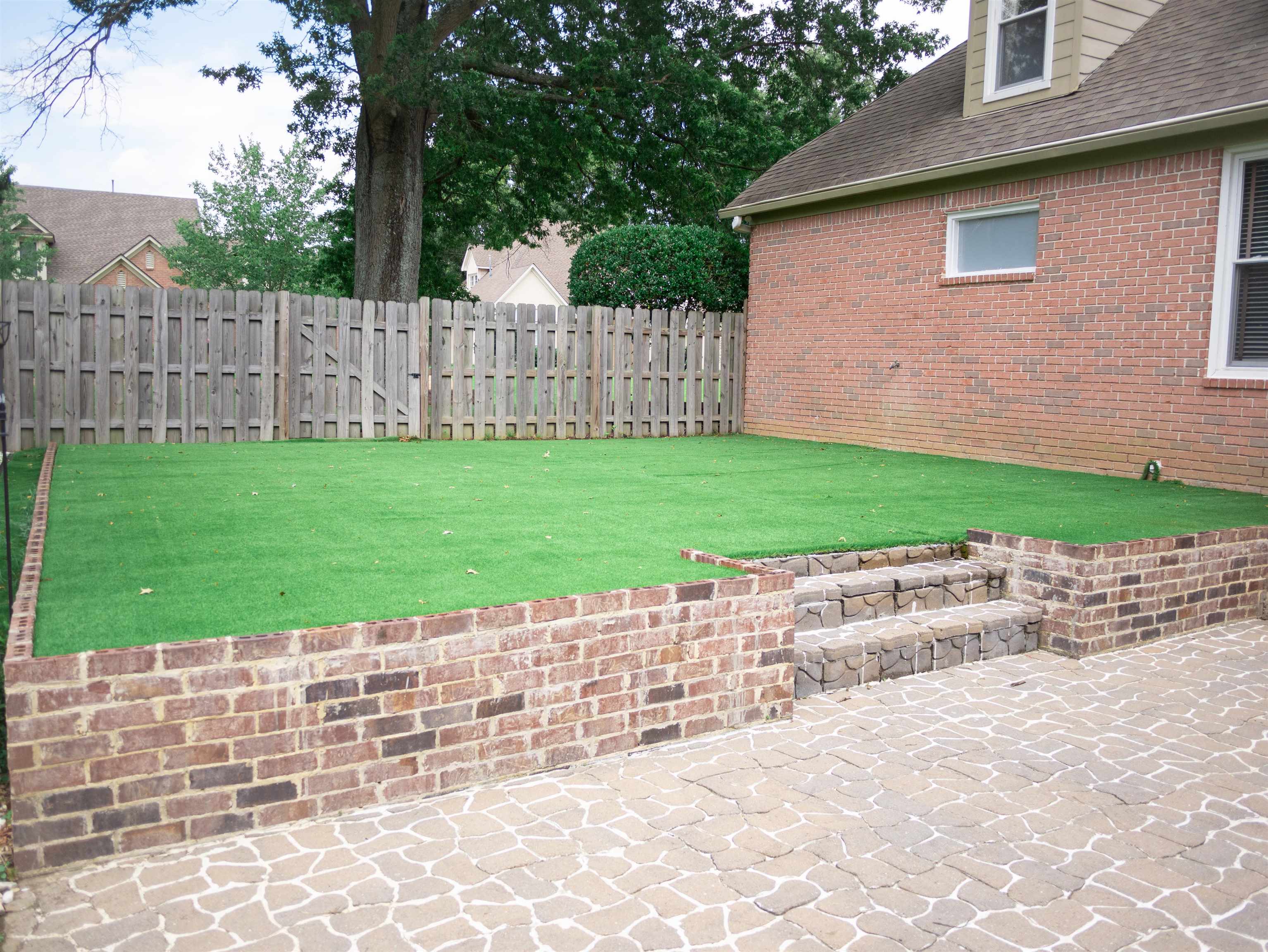 1923 Swynford Lane Collierville, TN 38017 - Photo 31 of 35 a view of a backyard with a garden