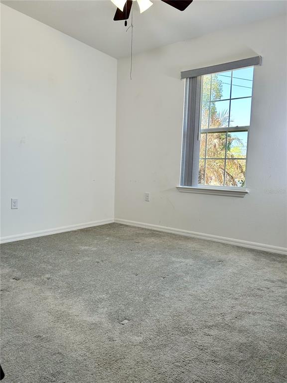 4096 Thunderbird Avenue Spring Hill, FL 34606 - Photo 12 of 20 an empty room with windows