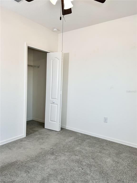 4096 Thunderbird Avenue Spring Hill, FL 34606 - Photo 14 of 20 an empty room with fan