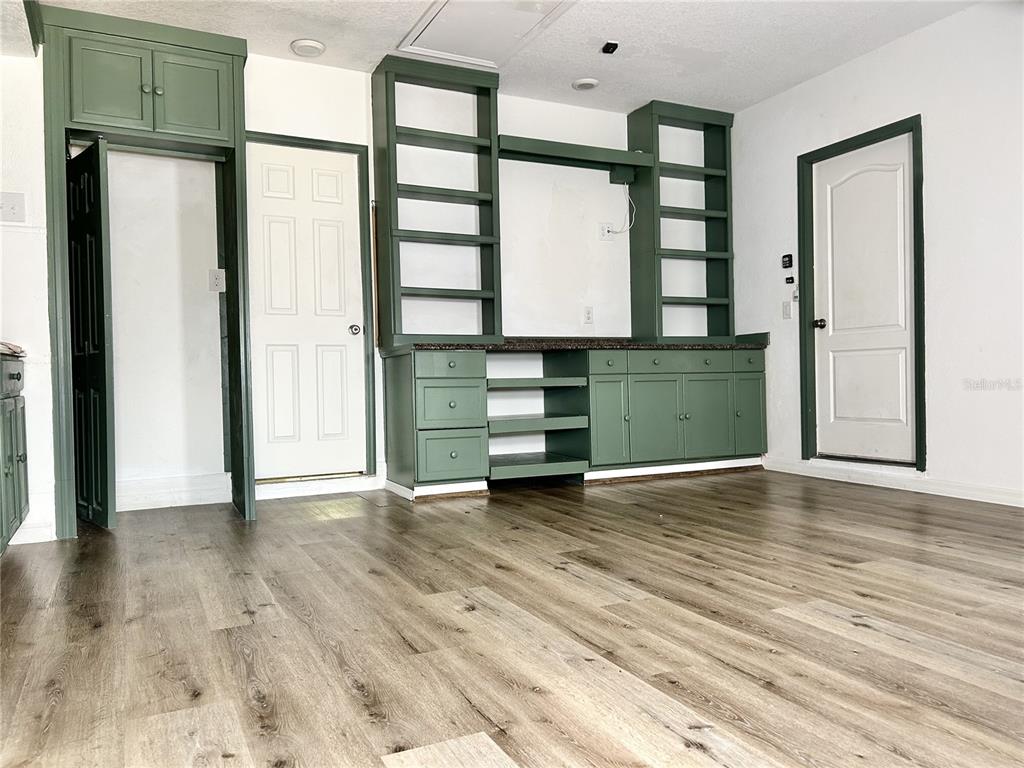 4096 Thunderbird Avenue Spring Hill, FL 34606 - Photo 18 of 20 a view of room with window and wooden floor