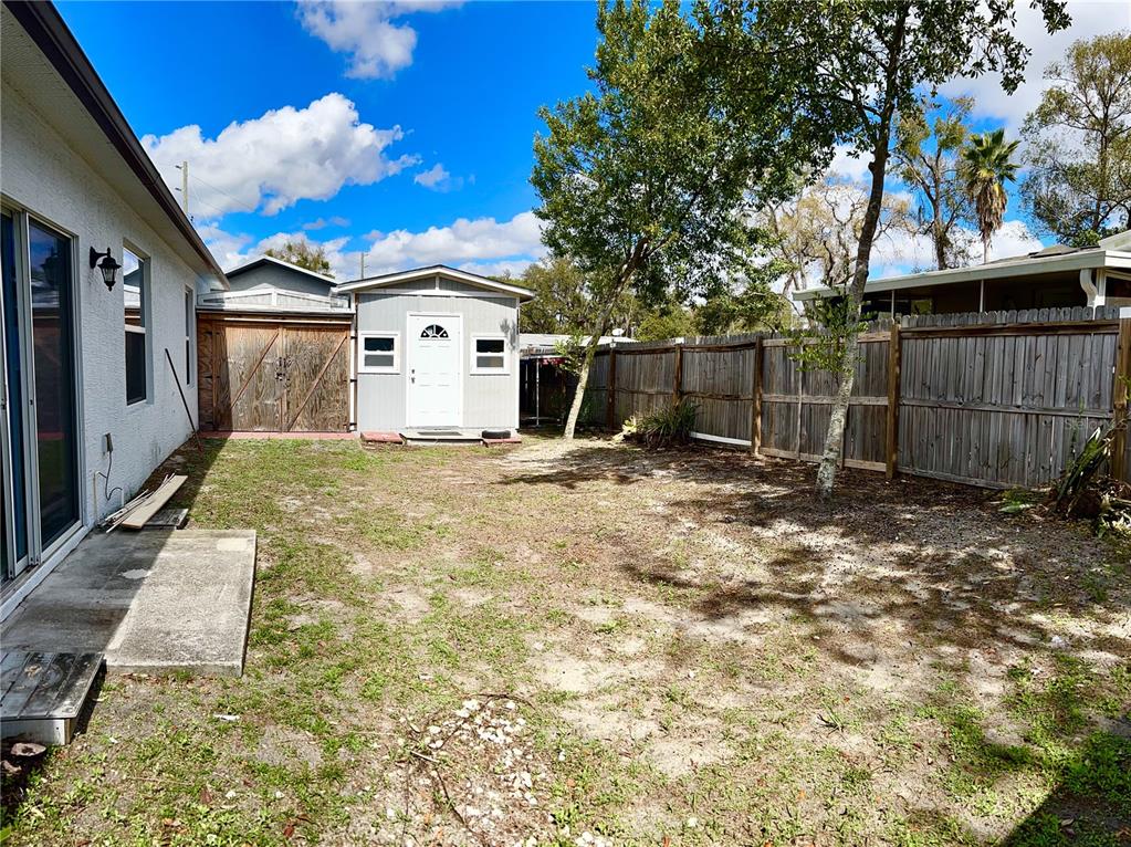 4096 Thunderbird Avenue Spring Hill, FL 34606 - Photo 19 of 20 a view of a house with a yard