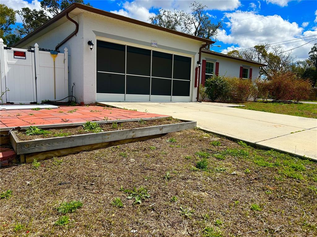 4096 Thunderbird Avenue Spring Hill, FL 34606 - Photo 2 of 20 a house with trees in front of it