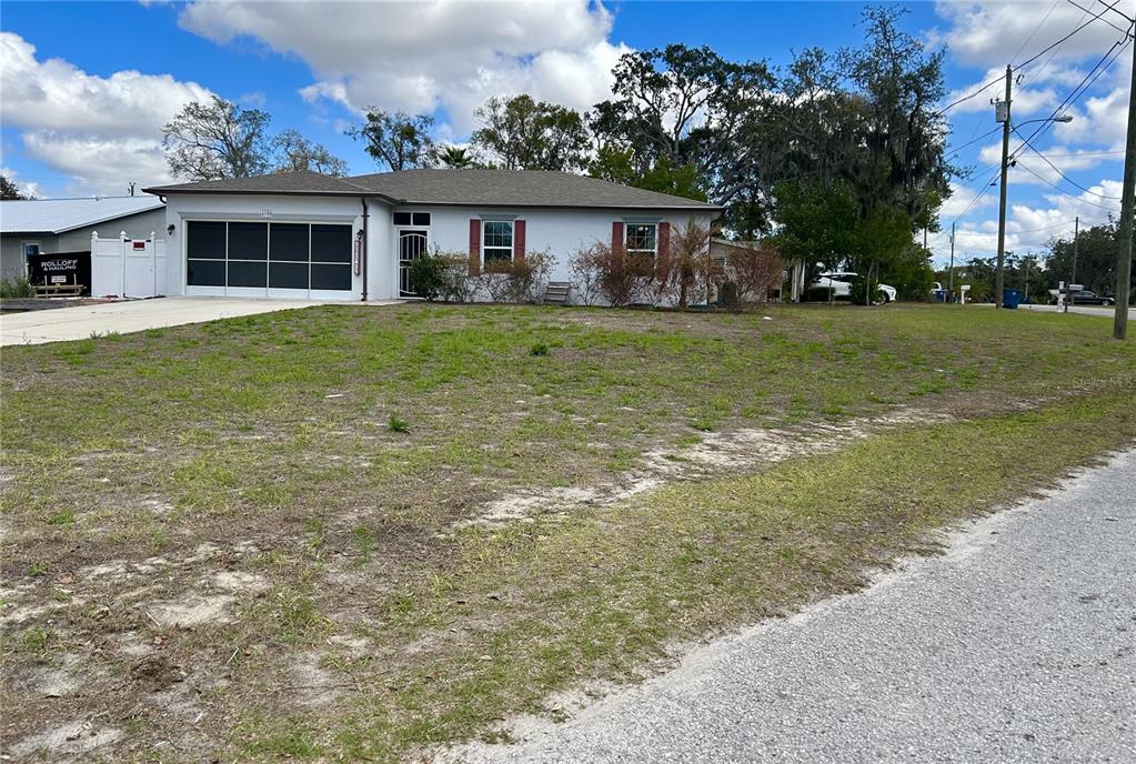 4096 Thunderbird Avenue Spring Hill, FL 34606 - Photo 4 of 20 a front view of house with yard and green space