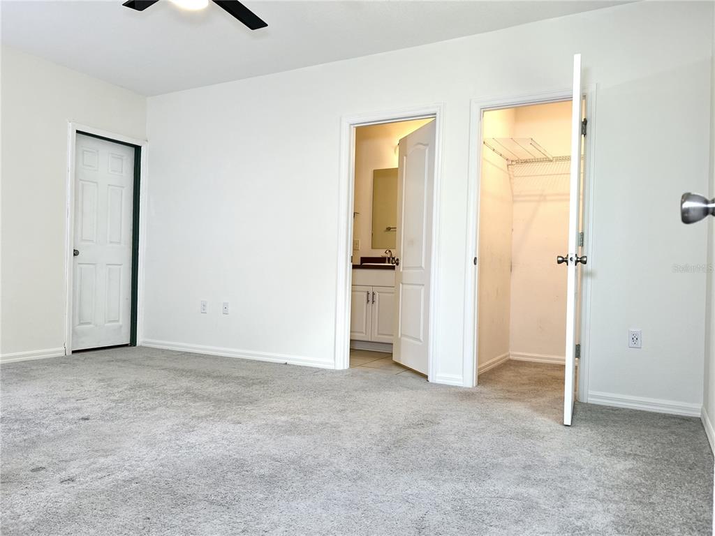 4096 Thunderbird Avenue Spring Hill, FL 34606 - Photo 8 of 20 an empty room with windows and closet