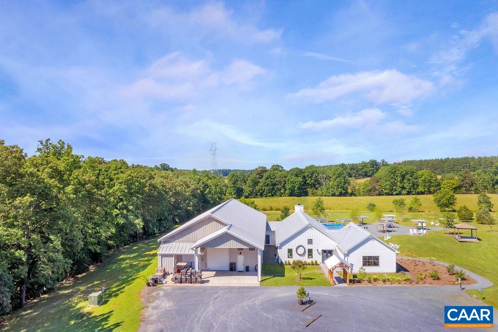 3304 A Ruritan Lake Road Palmyra, VA 22963 - Photo 2 of 37 an aerial view of a house with a big yard and large trees