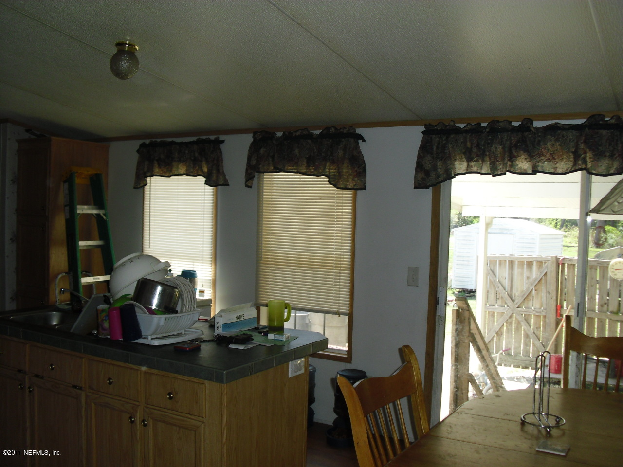 715 Georgetown Denver Road Crescent City, FL 32112 - Photo 2 of 4 Kitchen, Dining, Living open plan