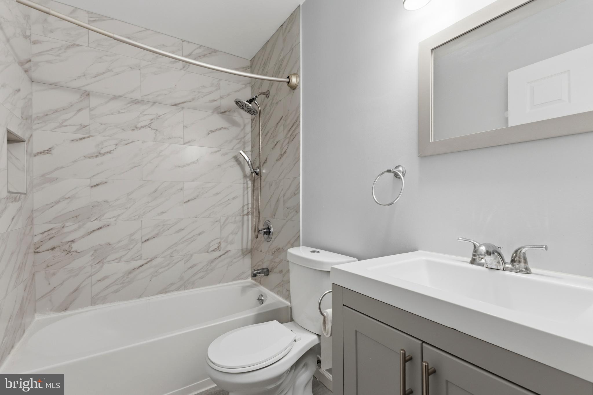 119 Jefferson Road Waldorf, MD 20602 - Photo 22 of 40 a bathroom with a sink toilet and shower