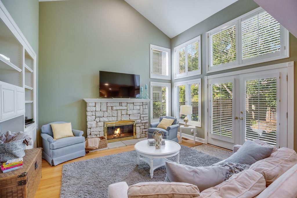 20 Trace Lane Half Moon Bay, CA 94019 - Photo 11 of 33 a living room with furniture a fireplace and a flat screen tv