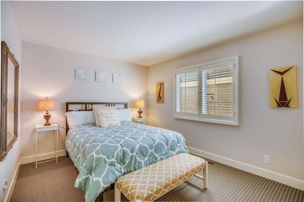 20 Trace Lane Half Moon Bay, CA 94019 - Photo 12 of 33 a bedroom with a bed and wooden floor