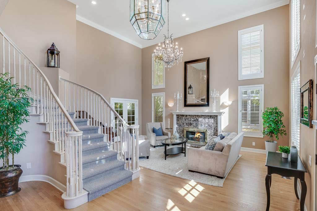 20 Trace Lane Half Moon Bay, CA 94019 - Photo 2 of 33 a living room with fireplace furniture and a chandelier