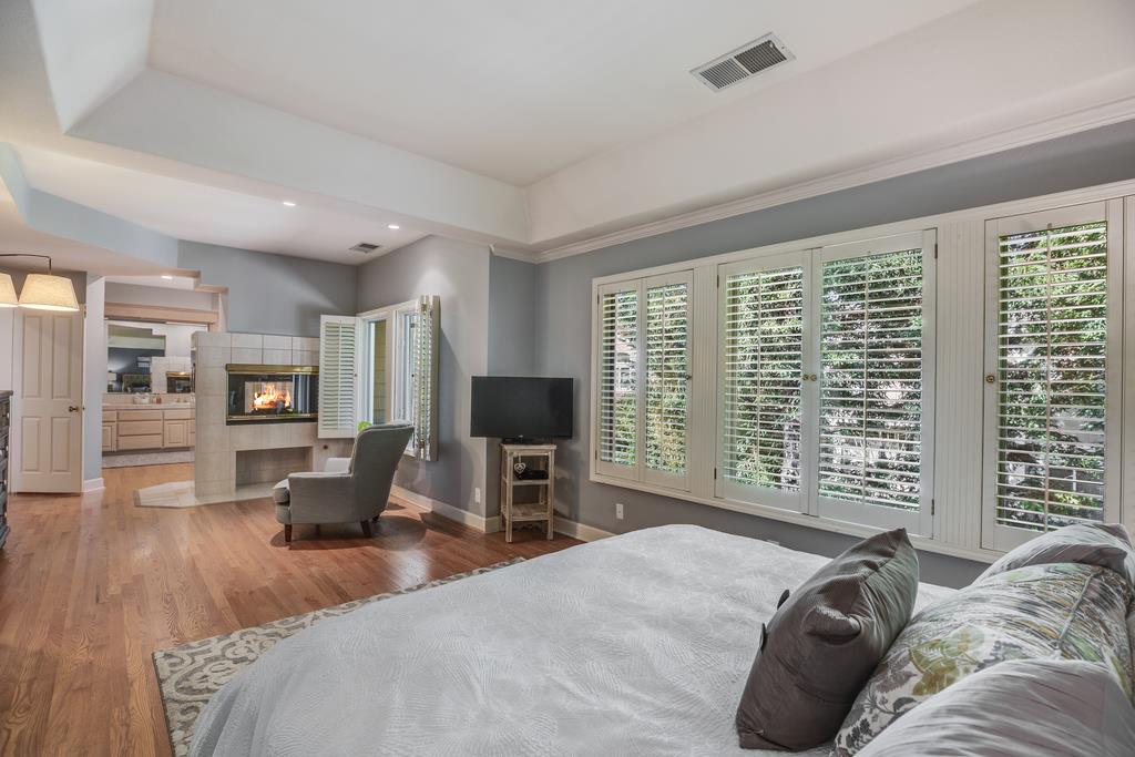 20 Trace Lane Half Moon Bay, CA 94019 - Photo 22 of 33 a bedroom with a bed and wooden floor