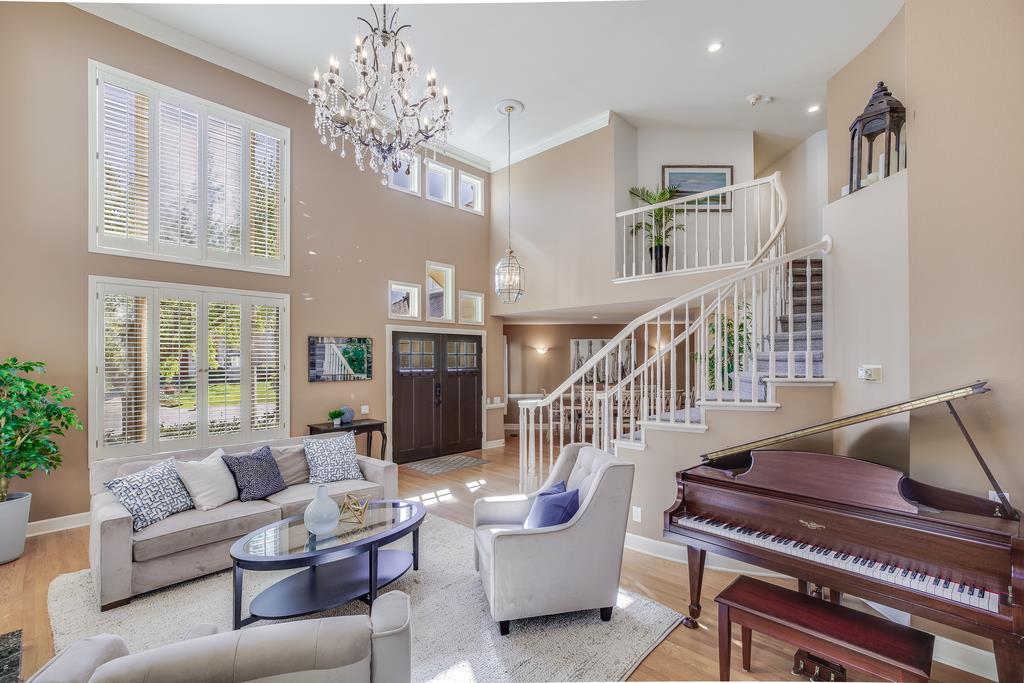 20 Trace Lane Half Moon Bay, CA 94019 - Photo 3 of 33 a living room with furniture and a chandelier