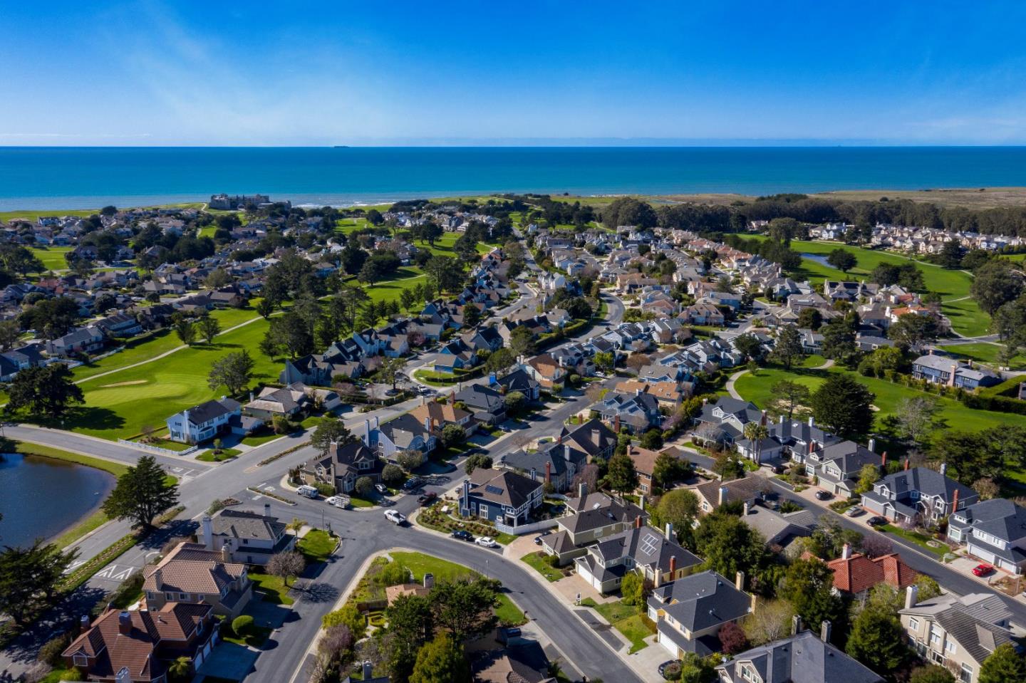 20 Trace Lane Half Moon Bay, CA 94019 - Photo 33 of 33 an aerial view of a city with lots of residential buildings and ocean view in back