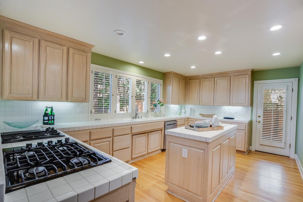 20 Trace Lane Half Moon Bay, CA 94019 - Photo 7 of 33 a kitchen with stainless steel appliances granite countertop a stove a sink a refrigerator and cabinets