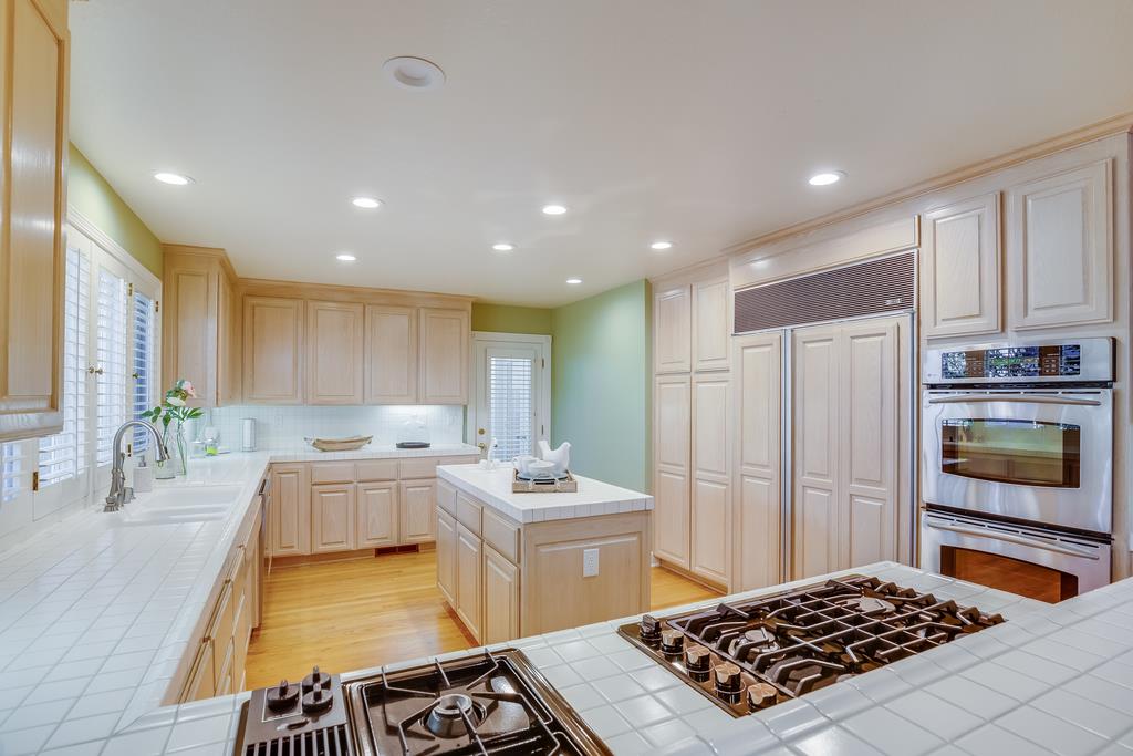 20 Trace Lane Half Moon Bay, CA 94019 - Photo 8 of 33 a kitchen with a sink stove and refrigerator