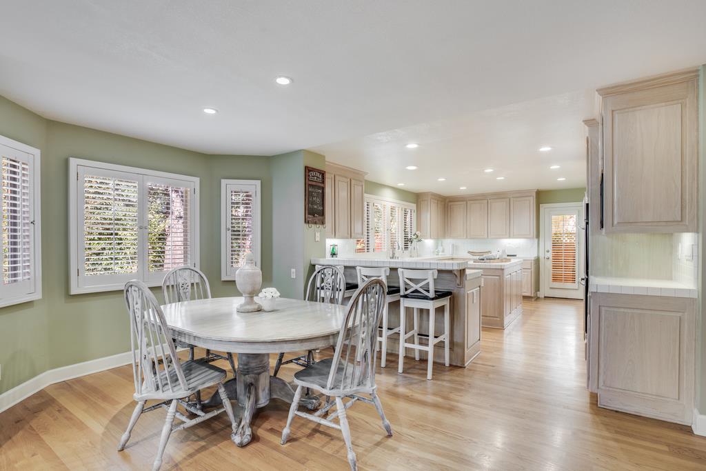 20 Trace Lane Half Moon Bay, CA 94019 - Photo 9 of 33 a view of a dining room with furniture and wooden floor