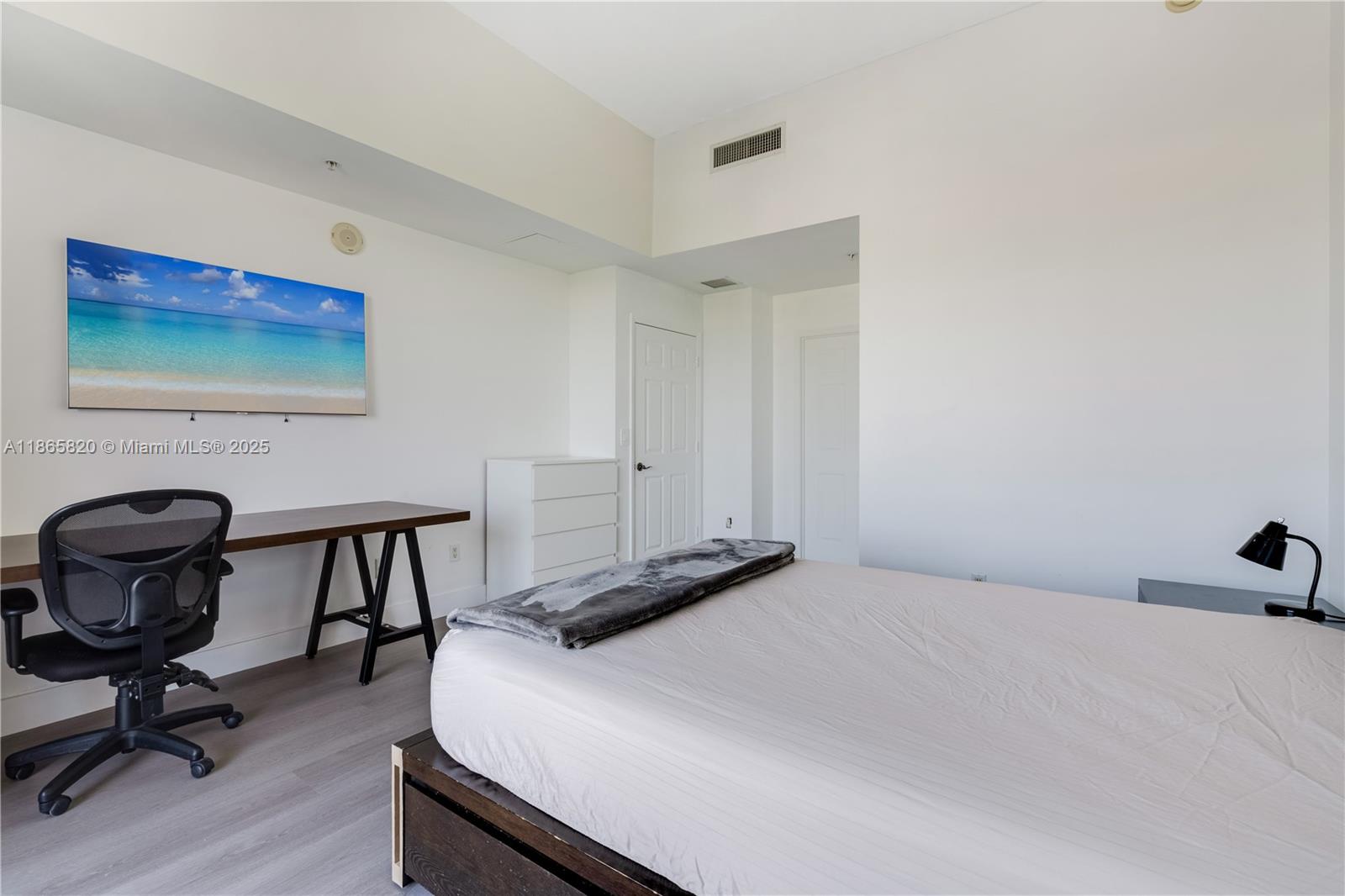 8395 Southwest 73rd Avenue, Unit 517 Miami, FL 33143 - Photo 12 of 27 a bedroom with a bed and a desk