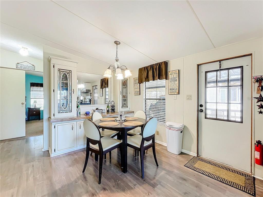 6 Cayman Circle Umatilla, FL 32784 - Photo 12 of 34 a view of a dining room with furniture and window