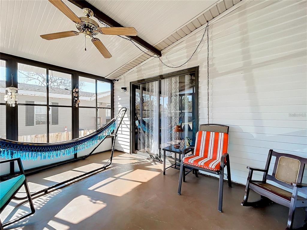 6 Cayman Circle Umatilla, FL 32784 - Photo 26 of 34 a living room with furniture and a floor to ceiling window
