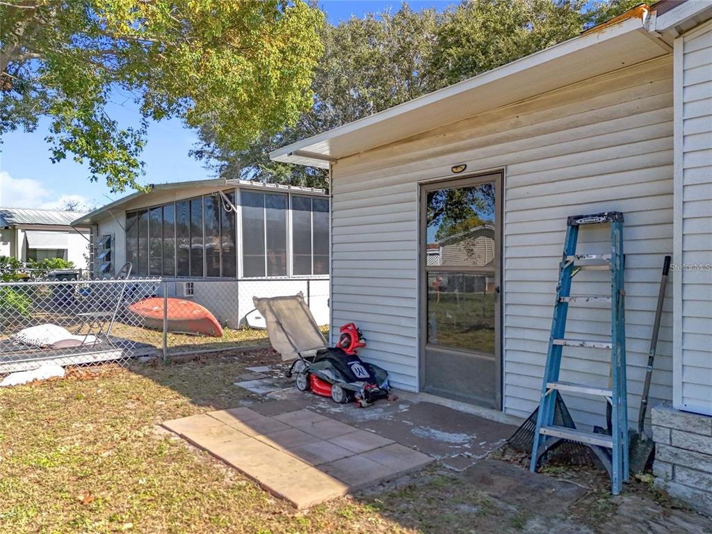 6 Cayman Circle Umatilla, FL 32784 - Photo 30 of 34 a view of a wooden chairs in patio