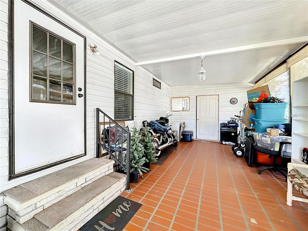 6 Cayman Circle Umatilla, FL 32784 - Photo 5 of 34 a living room with furniture pool table and a window
