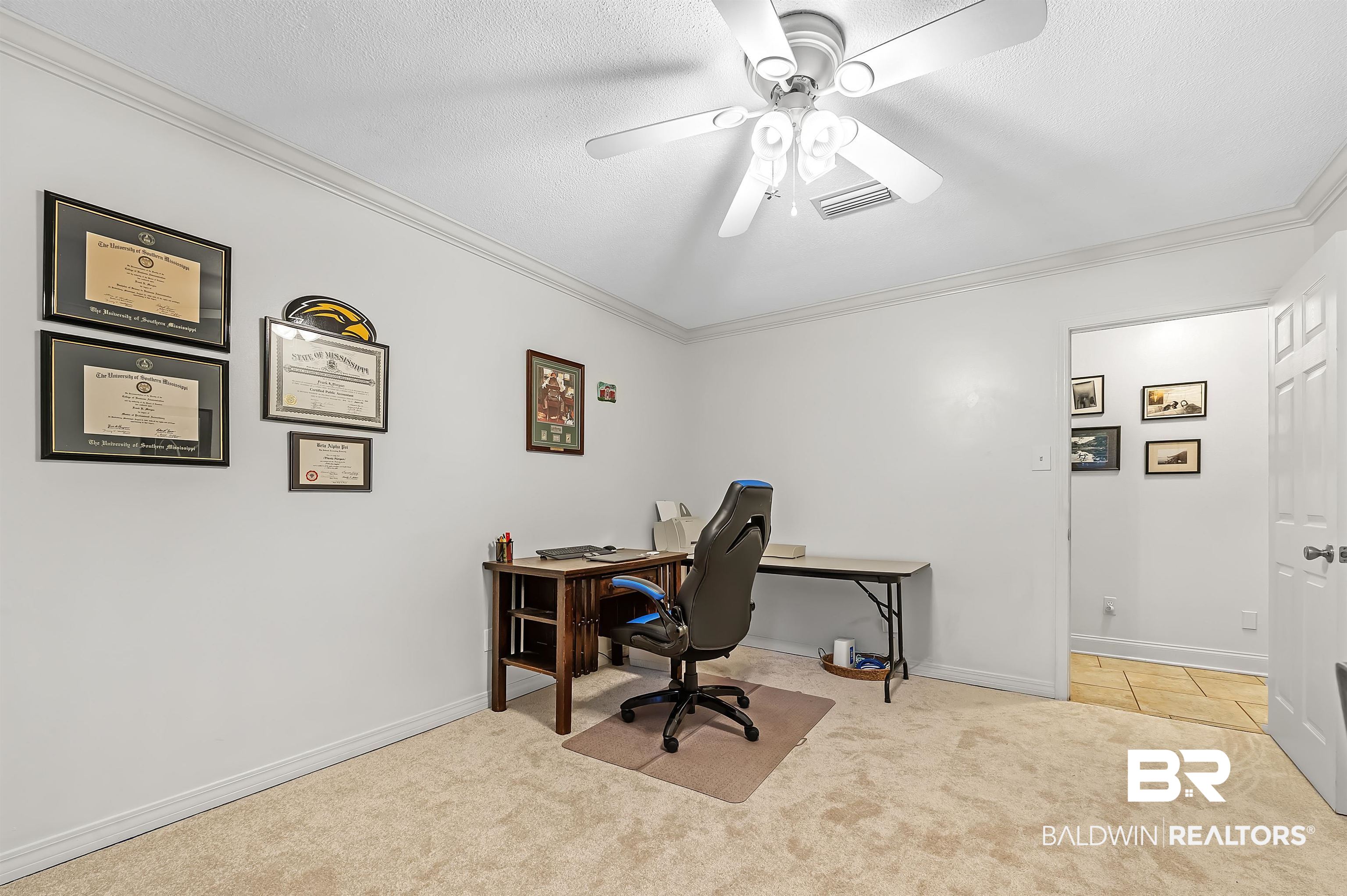 104 James Circle Daphne, AL 36526 - Photo 54 of 62 Carpeted home office with ceiling fan and crown molding