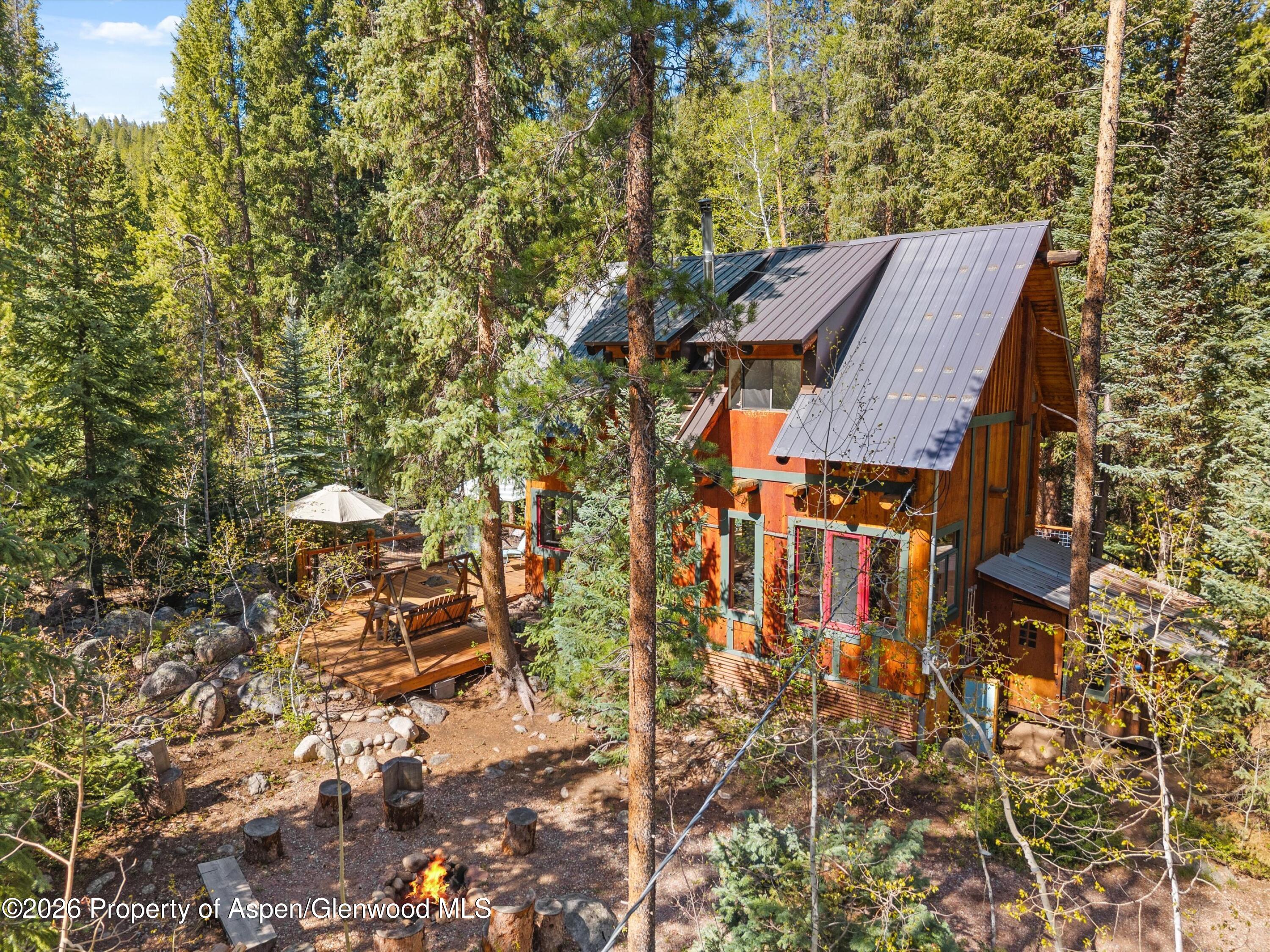 26608 Frying Pan Road Meredith, CO 81642 - Photo 3 of 49 view of a house with a yard