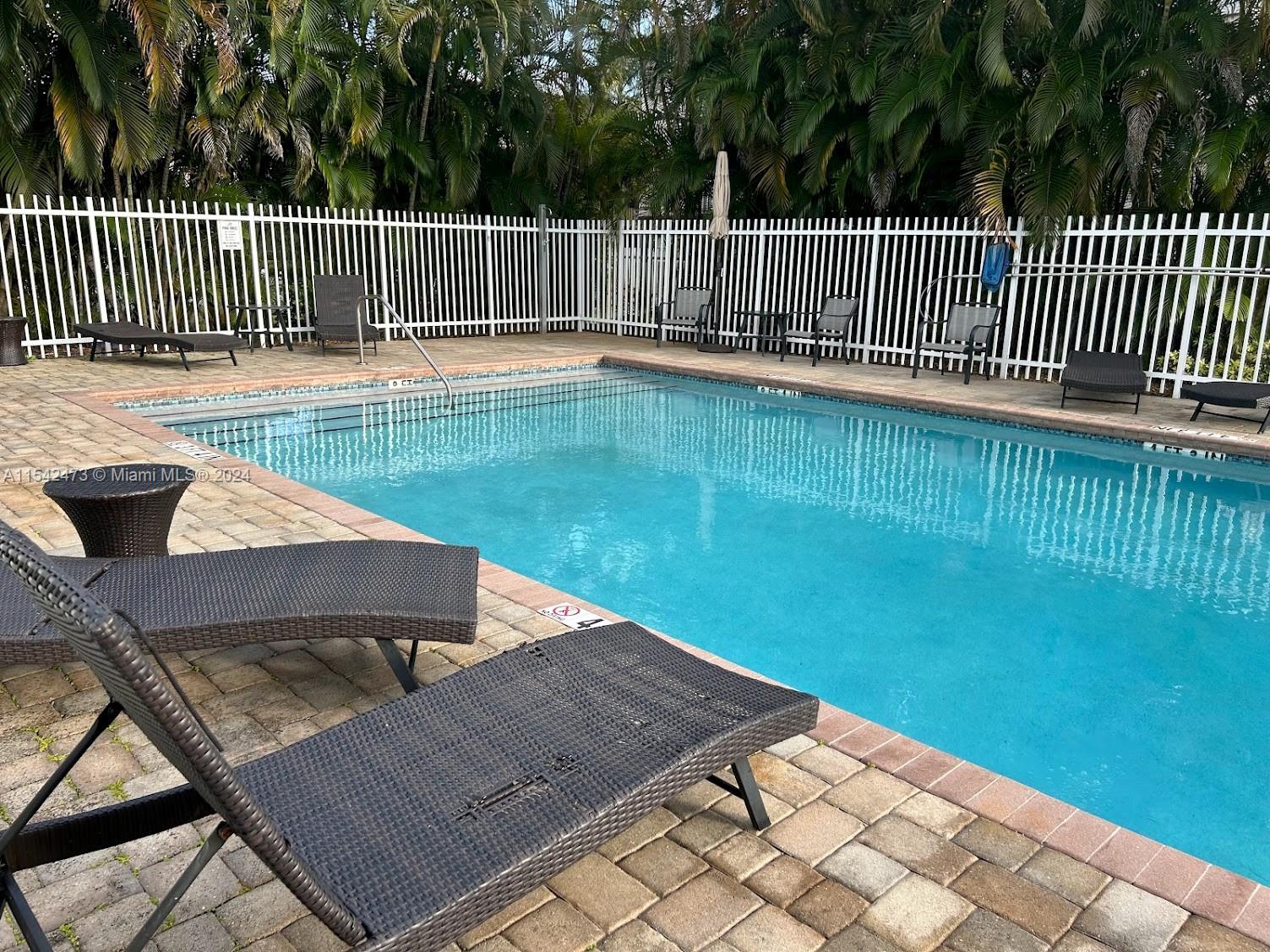 4802 Washington Street, Unit 5 Hollywood, FL 33021 - Photo 16 of 20 a view of a backyard with a garden