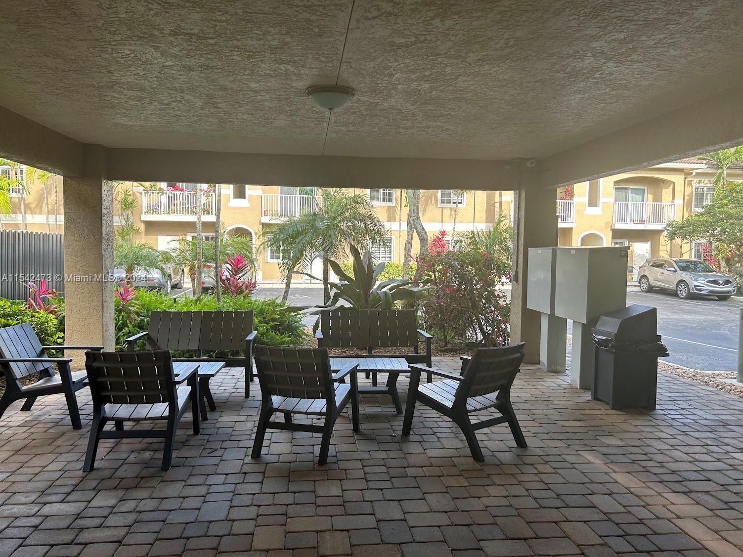 4802 Washington Street, Unit 5 Hollywood, FL 33021 - Photo 17 of 20 a outdoor space with chairs