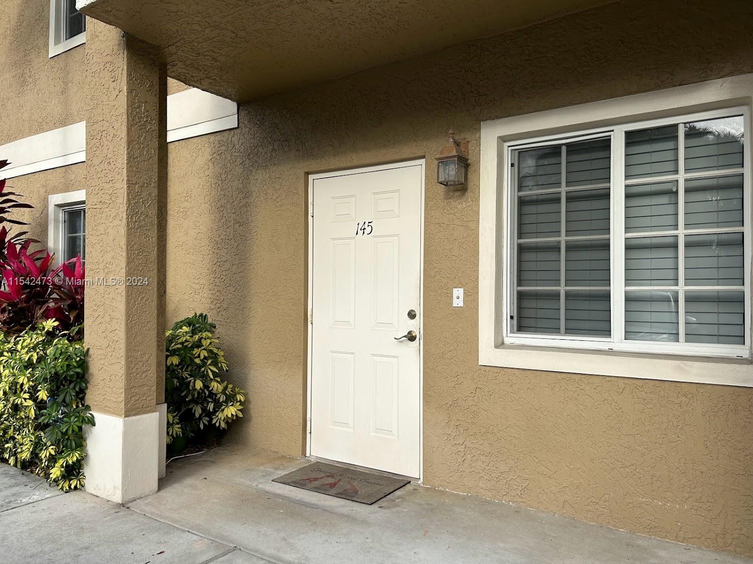 4802 Washington Street, Unit 5 Hollywood, FL 33021 - Photo 2 of 20 a view of a entryway door of the house