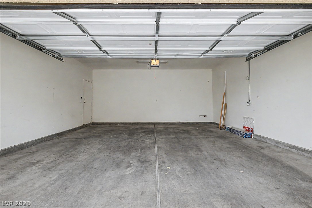 2153 Quarry Ridge Street, Unit 103 Las Vegas, NV 89117 - Photo 30 of 42 An immaculate garage offers a clean, versatile space for vehicles and storage.