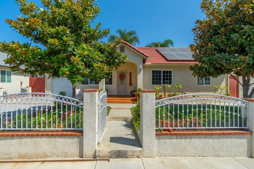 a view of a house with a wooden deck